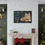 Custom cat memorial canvas shown on a wall. The canvas features the cat's picture, its years of life and inscription "Your paw prints are on my heart and there they'll stay forever"
