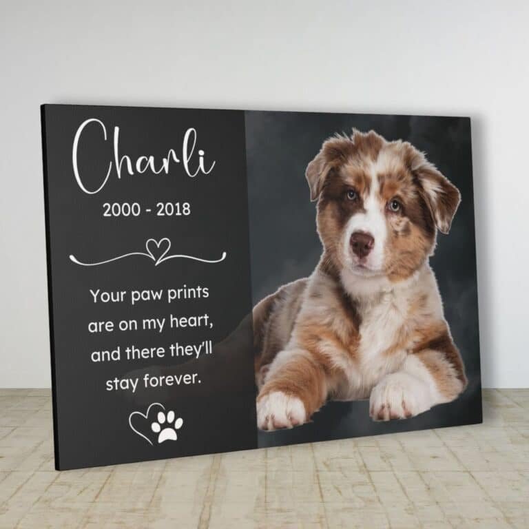 Close-up view of a custom dog memorial canvas featuring a puppy's portrait, personalized with the pet's name and a heartfelt tribute.