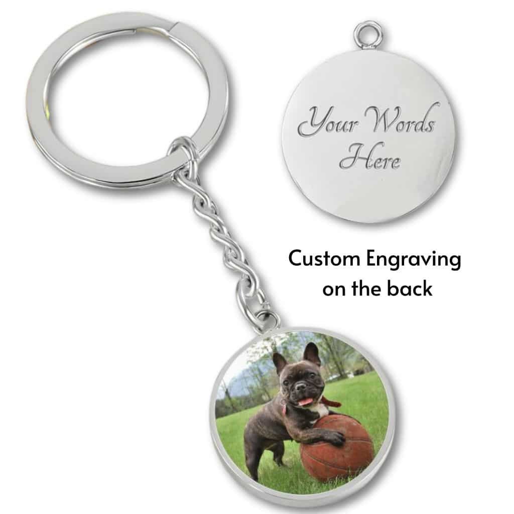 Personalized dog photo keychain in surgical steel, featuring a custom dog photo and engraved text. A durable and heartfelt accessory for dog owners, offering a lasting reminder of a beloved pet.