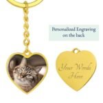 Personalized heart-shaped pet owner keychain in yellow gold finish, featuring a custom pet photo engraving and a sleek, polished design