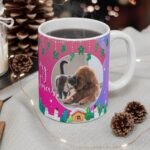 Pink personalized Christmas dog mug with dog photo, close-up view on table.