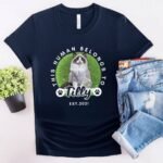 Cat lover gift shirt in navy, featuring a portrait of a cat, its name, and year of birth, with the text "This Human Belongs To"