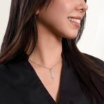 Name necklace gift with silver finish, shown on a model