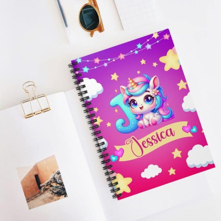 Personalized unicorn notebook for girls with a name showcasing the cute unicorn design, placed on a desk