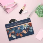 Custom name wristlet displayed open on a table, showcasing its elegant design and interior compartments — a personalized and stylish gift for women