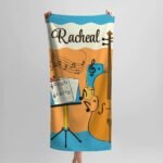 Personalized music-themed towel featuring musical notes and a custom name printed on it, perfect gift for musician