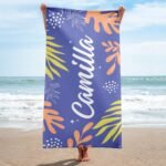 Personalized tropical towel with name for her in medium blue slate – features bold tropical leaf design and custom name, perfect for beach days or poolside relaxation