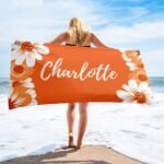 Summer gift for her – floral beach towel in vibrant orange color, personalized with name, ideal for beach days and vacations